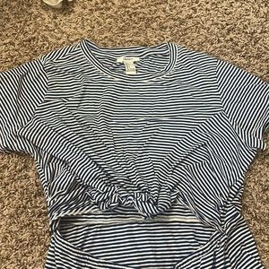 Cute summer blue and white striped dress with an opening in the middle